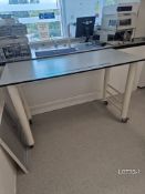 Proprietary mobile laboratory bench with grey Trespa worktop, 1500mm x 750mm x 940mm