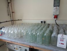 Large quantity of assorted glass bottles, beakers, etc.