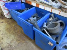 Four mobile bins with contents including plastic piping, elbows, T sections, etc.