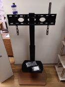 Floor mounted bracket TV stand