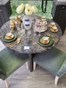 990mm diameter granite table with 2 green upholstered high back chairs (contents not included)