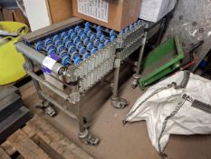Concertina roller feed table - situated on a mezzanine floor with a stairway up to it