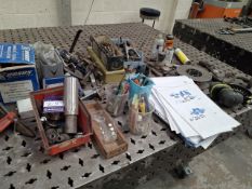 Quantity of nuts, bolts, and welding accessories to bench top