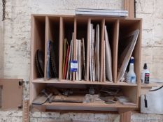 Wall mounted wooden compartment unit with quantity of saw blades