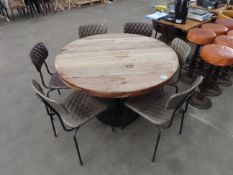 A Round Wooden Table with 6x Matching Chairs