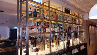 Assortment of wet stock to back bar display, including spirits (part and full bottles), mixers and