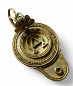 An Antonio Carli gold coloured metal mourning pendant,  in the form of a Roman lamp, the back set