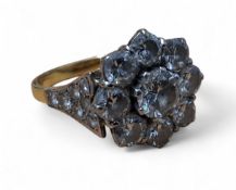 AMENDED DESCRIPTION - An 18ct gold diamond floral cluster ring, the platinum setting set