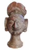 Antiquities - a terracotta head, Indian, 24cm high