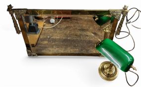 A gilt rectangular mirror, anthemions and scrolls to angles, flame and leafy tendrils, 50cm x 74cm;
