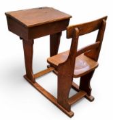 An early 20th oak and elm student's desk 87cm x 97cm x 47cm