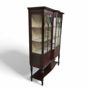An Edwardian Sheraton Revival mahogany and satinwood inlaid bow centre display cabinet, astragal