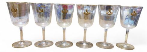 A set of six pedestal wine glasses, flared octagonal bowls, applied in gilt with crest, gilt line