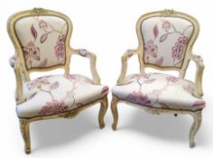 A pair of French Louis XVI style white painted side chairs, kidney shaped  backs, stuffed-over