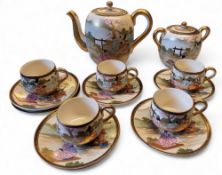 A Japanese satsuma tea  service, comprising five cups, six saucers, teapot and two handled