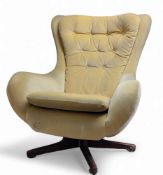 A 20th century G-Plan Blofeld type swivel wingback chair,  yellow velour, c. 1975 This lot is sold