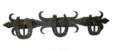Equestrian interest - a 19th century wrought iron tack room coat rack, applied horse shoe hooks,