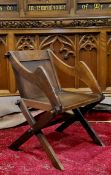 An unusual early 20th century Bishop's chair, originally from Dore Church, X frame suports,