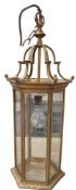 A George III style gilt metal hexagonal hall lantern, scroll mounts, 62cm high