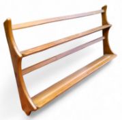 A mid 20th century Ercol 'Golden Dawn' model plate rack, 50cm high,  97cm wide,  14cm deep