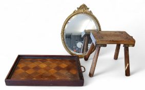 A rustic pine milking stool, rectangular top, 26cm high, 25cm wide, early 20th century;     a