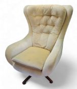 A 20th century G-Plan Blofeld type swivel wingback chair,  yellow velour, c. 1975 This lot is sold