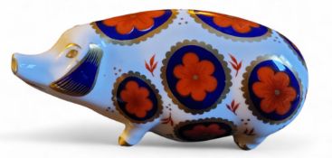 A  Royal Crown Derby paperweight,  of a pig, gold stopper, printed mark