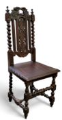 A Carolean Revival oak hall chair, leafy cresting, pierced leafy splat, solid seat,  barley twist