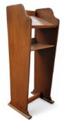 A 20th century stained pine freestanding lectern, 142cm high, 53cm wide, 43cm deep