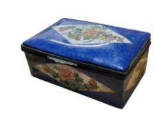 A Chinese rectangular porcelain box and cover, painted in polychrome enamels with song bird and