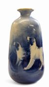 A Grimwades Winton Ware vase, signed B Austin, in tones of blue with gundogs, 16.5cm high, printed