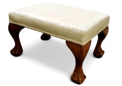 A contemporary rectangular foot stool, cream damask stuffed-over top, cabriole legs, ball and claw