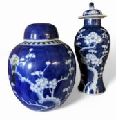 A Chinese ginger jar, decorated with blossoming prunus, domed cover, 22cm high, double concentric