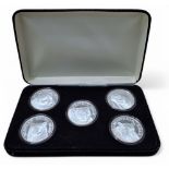 A silver proof set of six coins, each depicting a bear including Black Bear, Alaskan Brown Bear,