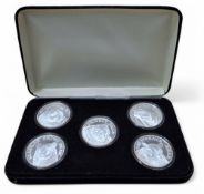 A silver proof set of six coins, each depicting a bear including Black Bear, Alaskan Brown Bear,