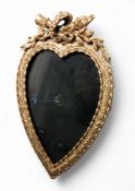 A contemporary gilt metal heart shaped easel photograph frame, crossed quiver and flaming torch