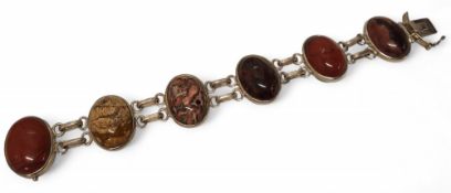 A contemporary silver and semi-precious stone, each link set with an oval polished cabochon each