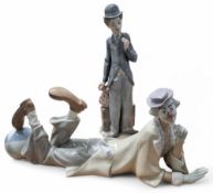 A Lladro figure of a clown with ball, 4618, 38cm long; Lladro figure of Charlie Chaplin, 5233 (