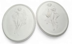 A large pair of oval plaster plaques, in relief with classical figures, 43cm x 34cm