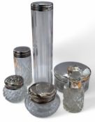Silver mounted glass dressing table jars, varying sizes, one monogrammed (6)
