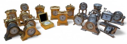 Twenty gold and sliver plated miniature clocks in various forms including carriage, alarm, Napoleon,