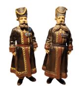 A pair of Russian cold painted bronze figures of Cossacks, in the manner of Faberge, modelled as A.