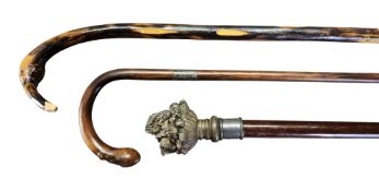 A novelty walking cane, the finial with basket of fruit, 92cm high;   a walking stick, silver