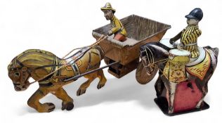 A Louis Marx horse drawn cart and coachman c.1950s; a Wells Brimtoy, tinplate clockwork horse