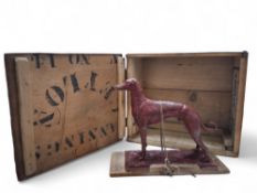 An early 20th century unusual wax model of a greyhound on naturalist base approx. 16cms high,
