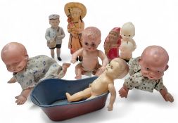 A German celluloid figure of a young Postal Boy; a Japanese celluloid figure of Father Christmas;