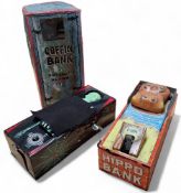 A Japanese Yone tinplate Coffin Bank, clockwork, working order, original window box,; a Yone