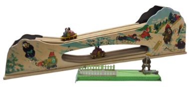 A Russian tinplate Toboggan Run, clockwork, heavy gauge tinplate, lithographed side panels with snow