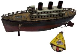 A German Arnold? tinplate clockwork three funnel liner, loose top, propeller rotates when wound,