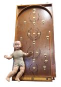A Chad Valley bagatelle board, c.1940;  a composite doll, sleeping eyes, moulded hair, cloth body,